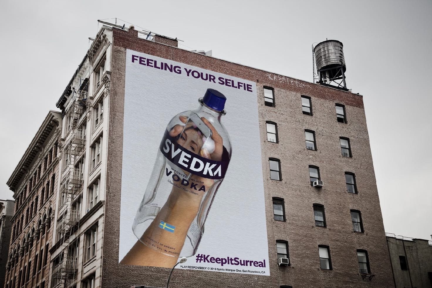 wallscape: feeling your selfie, a svedka bottle in a phone-camera pose, #keepitsurreal